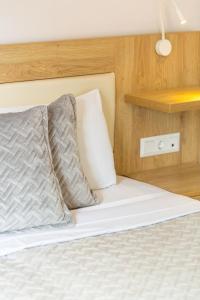 Postel nebo postele na pokoji v ubytování Gorgona Hotel