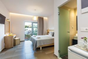Postel nebo postele na pokoji v ubytování Gorgona Hotel
