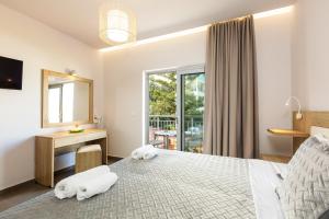 Postel nebo postele na pokoji v ubytování Gorgona Hotel