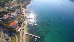 an aerial view of a beach with boats in the water at Apartments Anita 2 in Rab
