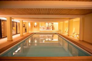 a swimming pool in a house at Alpenlodge Val Gronda in Obersaxen