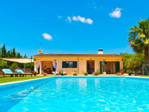 a swimming pool in front of a house at Villa Can Coll de Sencelles, Sa Vileta pool and views in Costitx