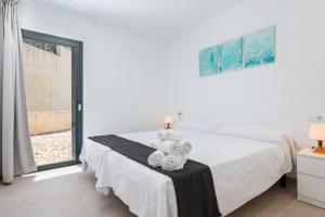 Postel nebo postele na pokoji v ubytování Mirador Blue F - Cala Sant Vicenç