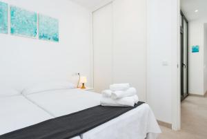 Postel nebo postele na pokoji v ubytování Mirador Blue F - Cala Sant Vicenç