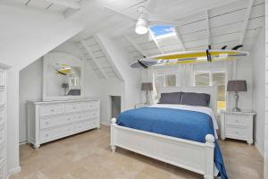 a bedroom with a bed with a surfboard on it at 307 Thirty Fifth Street in Newport Beach