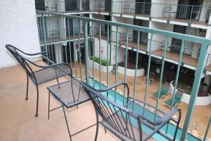two chairs sitting on a balcony of a building at Oak Square 201 in Gatlinburg