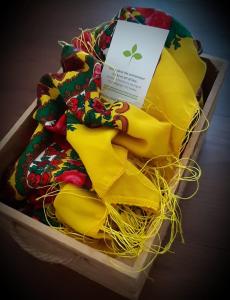 a box filled with yellow blankets and a card at GuestReady - CastleRock Pub (live music) 1F in Porto