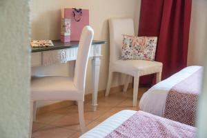 Voodi või voodid majutusasutuse Hotel du Forum toas