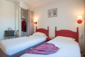 Voodi või voodid majutusasutuse Hotel du Forum toas