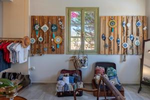 a room with a window and plates on the wall at Parosland Hotel in Aliki