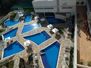 an overhead view of a pool with blue pools at Park Veredas- Rio Quente Temporada in Rio Quente