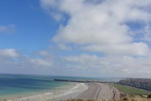 a view of a beach with the ocean at Le 61 - hyper centre - WIFI in Dieppe +2 photos