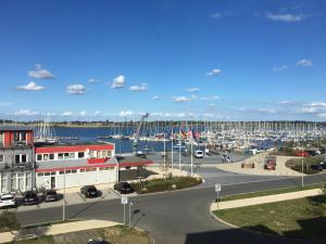 a marina with a bunch of boats in the water at Südstrandwohnung in Fehmarn