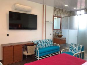 TV a/nebo společenská místnost v ubytování ATENEA SPA Hotel