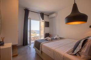 Postel nebo postele na pokoji v ubytování SeaCode Villas + 37 fotografií