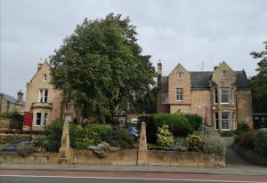 a house with a garden in front of it at Cumberland Hotel in Edinburgh
