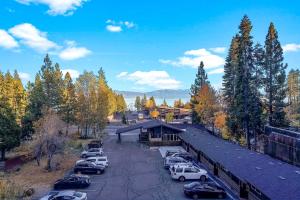 a train station with cars parked in a parking lot at Basecamp Tahoe City in Tahoe City