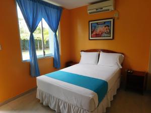 Katil atau katil-katil dalam bilik di Siona Hotel