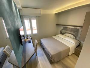Ein Bett oder Betten in einem Zimmer der Unterkunft Affittacamere Ventisettembre
