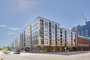 a rendering of a building on a city street at Sonder at East End in Minneapolis