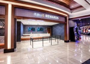a true rewards lobby with atrue rewards sign on the wall at The STRAT Hotel, Casino and SkyPod in Las Vegas