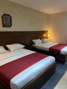 Letto o letti in una camera di Posh Hotel and Suites Victoria Island