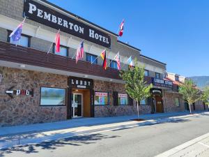 a large building with a sign on the side of it at Pemberton Hotel (Motel) in Pemberton