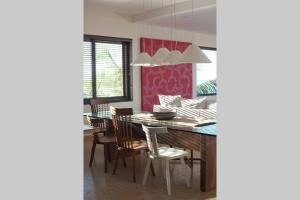 a dining room with a table and chairs at Spectacular Beachfront at veneros fully staffed in Cruz de Huanacaxtle