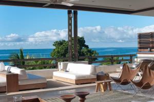 a living room with a view of the ocean at Spectacular Beachfront at veneros fully staffed in Cruz de Huanacaxtle