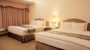 Postel nebo postele na pokoji v ubytování Zhong Ke Hotel