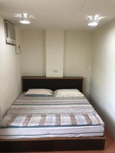 Postel nebo postele na pokoji v ubytování Dongyin Homestay連江縣民宿054號