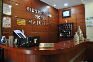 a reception desk in a hotel practition at Hotel Majestic 2 by Bustamante Hotels in Cuenca