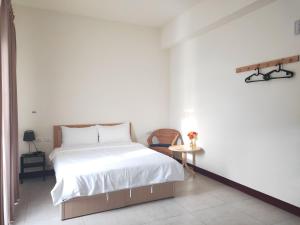 Giường trong phòng chung tại 響樂池上電梯民宿1663 Chishang Music Guesthouse