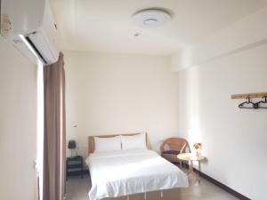 Giường trong phòng chung tại 響樂池上電梯民宿1663 Chishang Music Guesthouse