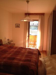 Postel nebo postele na pokoji v ubytování Appartement Colussi