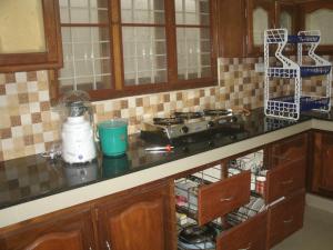 a kitchen with a counter top with a blender on it at Jacaranda Holiday Home in Cochin