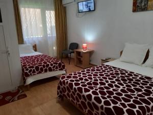 Postel nebo postele na pokoji v ubytování Vila Albatros