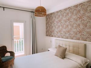 Postel nebo postele na pokoji v ubytování Boutike Guesthouse