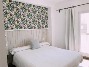 Postel nebo postele na pokoji v ubytování Boutike Guesthouse