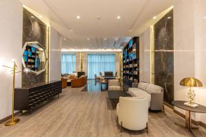 a lobby of a hotel with a waiting room at Edge Creekside Hotel in Dubai