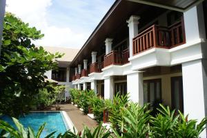 a view of the courtyard of a resort with a swimming pool at Athena Hotel in Pakse