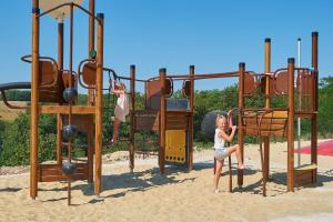 two young girls playing on a playground at Domaine de Lanzac in Lanzac