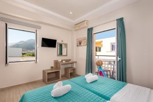 A bed or beds in a room at Sisi Breeze Hotel