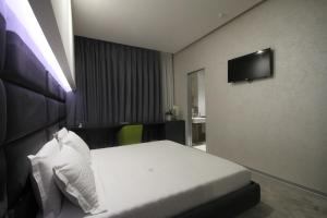Postel nebo postele na pokoji v ubytování Albes Hotel