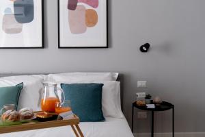 Postel nebo postele na pokoji v ubytování Il Pumo - Apulian Rooms Bari Piazza Moro