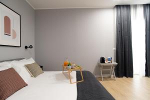 Postel nebo postele na pokoji v ubytování Il Pumo - Apulian Rooms Bari Piazza Moro