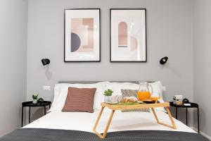 Postel nebo postele na pokoji v ubytování Il Pumo - Apulian Rooms Bari Piazza Moro