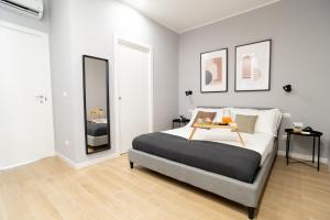 Postel nebo postele na pokoji v ubytování Il Pumo - Apulian Rooms Bari Piazza Moro