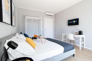 Postel nebo postele na pokoji v ubytování Il Pumo - Apulian Rooms Bari Piazza Moro