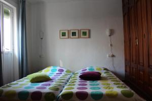 A bed or beds in a room at Casa Sonrisa